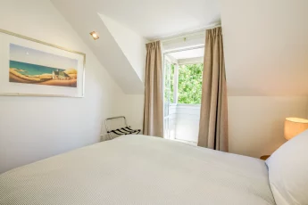 Sunlit second bedroom at Capital Cottage