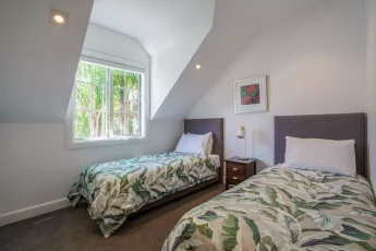 Third bedroom with two single beds at Butterfly Cottage