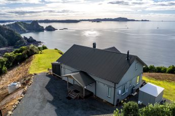 Aerial vista over 3 bedroom vacation rental with sauna - Ocean View, Bay of Islands Holiday Homes, New Zealand