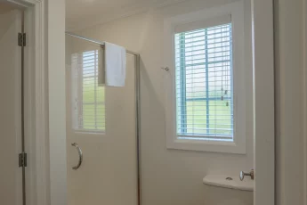 Bathroom with shower and vanity at Capital Cottage