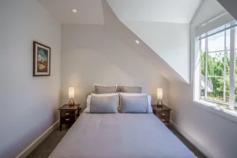 Sunny upstairs master bedroom at Bellbird Cottage