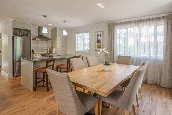 Open plan living, dining and kitchen inside Bellbird Cottage